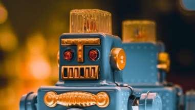 Close up photo of a metallic blue robot toy.